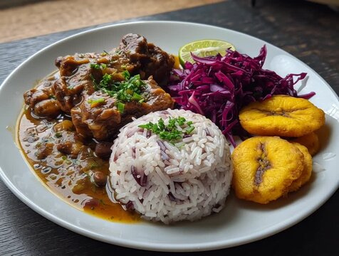 Delicious oxtail stew with rice and peas, fried plantains, and red cabbage