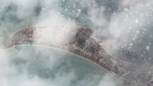 Rotating flying over Mannar Island Sri Lanka satellite view from space with passing clouds based on Nasa imagery