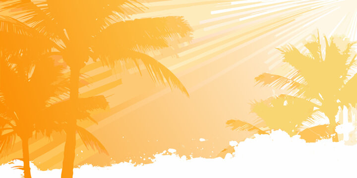 Silhouette of palm trees against a vibrant orange and yellow sunset