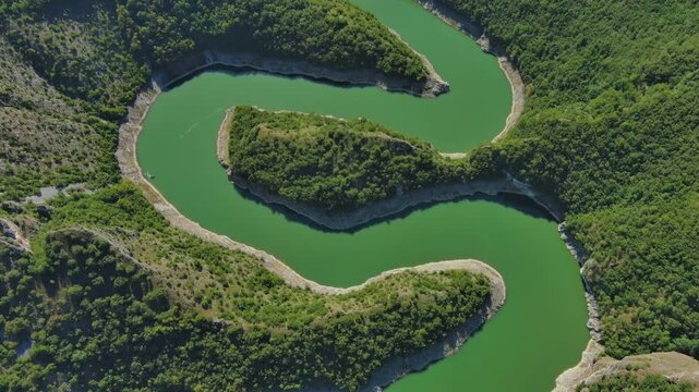 Aerial top view of curved meanders in canyon of Uvac river, Serbia, 4k