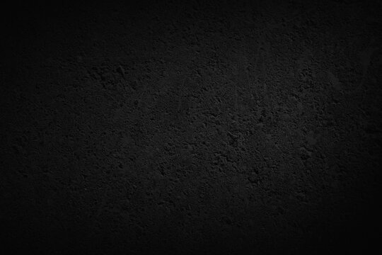 Black concrete texture background featuring rough grunge wall surface