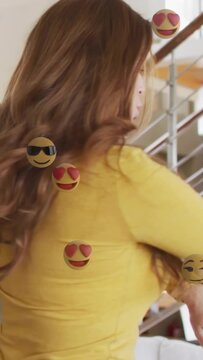 Vertical video: Woman in yellow top puckering and moving torso with emojis, pal hugging for social
