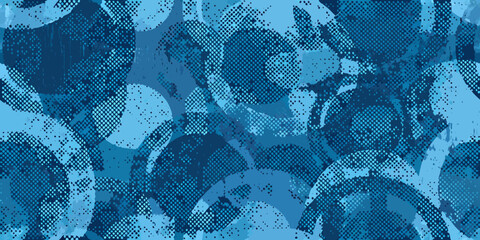 Abstract blue camouflage pattern with overlapping circles and textured details © Ramanath