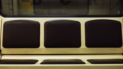 Moscow Metro train interior with vintage brown seats and cream upholstery