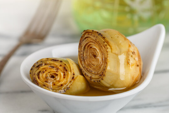 Carciofi alla Romana. Roman artichokes with herbs and olive oil. A delicious snack. Antipasti. Selective focus