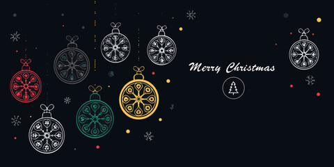 Festive christmas ornaments and greeting with a dark background © Sudhakar
