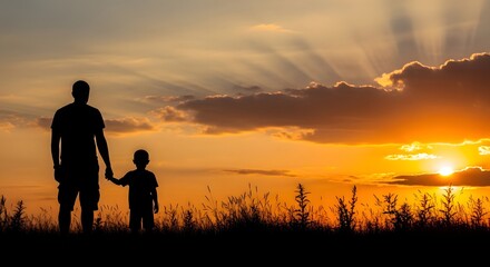 Fototapeta premium Silhouette of a man and child watching sunset in a serene landscape