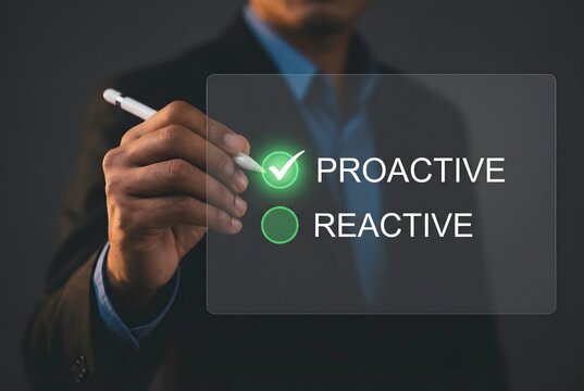 Businessman pointing to a virtual screen with proactive and reactive options highlighted