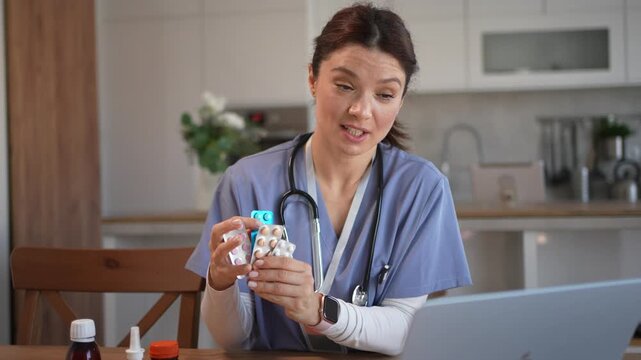 Female doctor explaining medications during online consultation