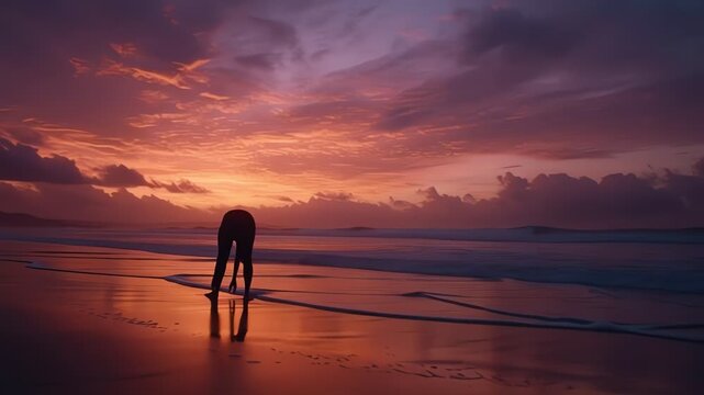 Woman silhouette practicing yoga on beach at sunset performing surya namaskar with dramatic sky and peaceful ocean background