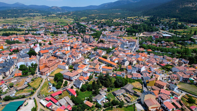 An aerial panorama view around the old town city El Espinar on a sunny noon in Spain.