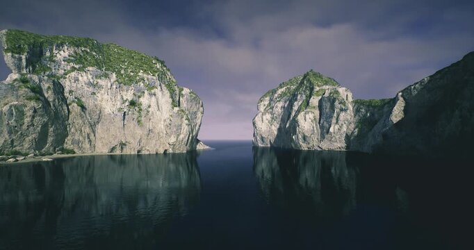 Stormy sea cliffs under brooding sky, heavy cloud banks rolling toward jagged rock faces, dark reflections on choppy water, windblown spray and dramatic