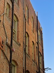 Obraz premium Brick mill building with exterior plumbing