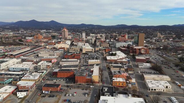 Drone ascending above downtown Roanoke Virginia city blocks