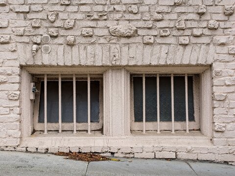 basement windows of rusticated brick wall