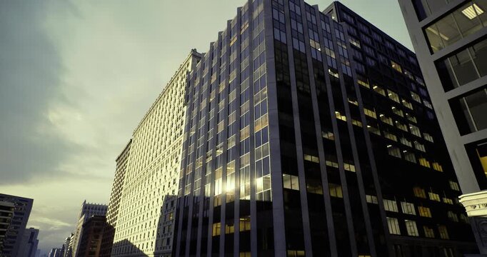 Curved glass atrium with warm reflections, architect inspects sweeping lobby facade, lightfilled curvature and layered windows create inviting corporate