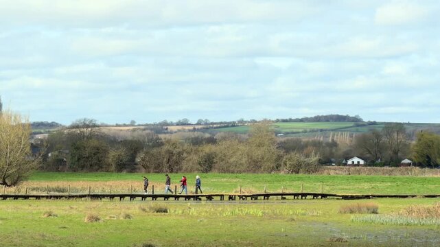 People walking at Spring landscape at Bourne End, Marlow, Buckinghamshire, England. Spring Sunny day