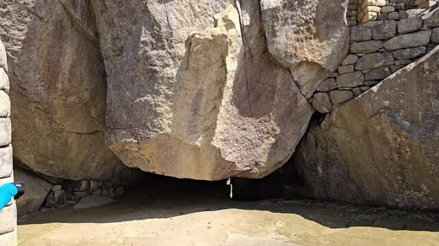 Temple of the Condor, Machu Picchu, Peru - 27 June 2024. Large carved stone material formation forming the condor shape within Inca masonry walls inside the famous place archaeological complex.