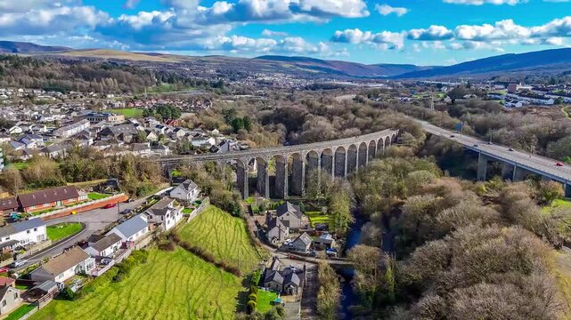 A rotating aerial view above the Cefn Coed Viaduct at Merthyr Tydfil, Wales, UK