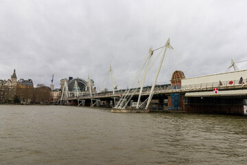 Fototapeta premium A bridge across the waters of the Thames River in London England UK