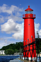 Fototapeta premium Bright Red Grand Haven Lighthouse on Lake Michigan