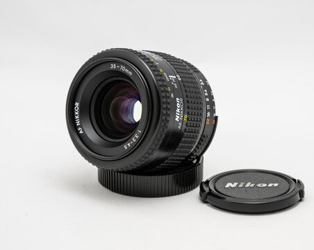 Gothenburg, Sweden - July 28 2024: Nikon zoom lens standing upright on neutral surface.