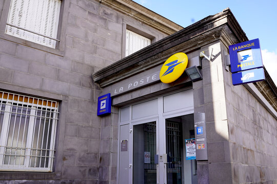 French La Poste office building facade with La Banque Postale signs and stone wall