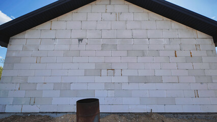 Obraz premium Building house wall using aerated concrete technology for modern construction