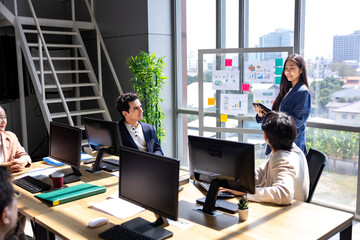 Team of young asian entrepreneur have small team meeting for project for marketing and sale management with skyscraper view for business startup and education usage