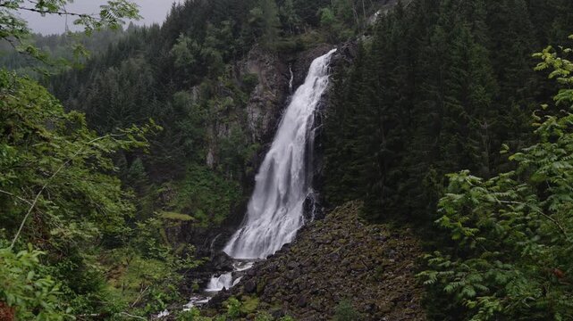 L&aring;tefossen waterfall in rainy evening in Norway