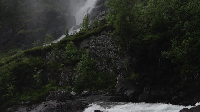 L&aring;tefossen waterfall in rainy evening in Norway