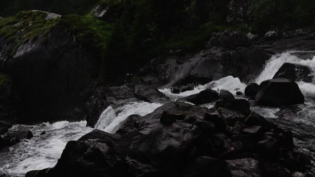 L&aring;tefossen waterfall in rainy evening in Norway