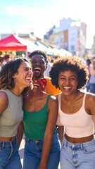 Fototapeta premium Joyful diverse friends laughing together at an outdoor summer festival, celebrating friendship and good times.