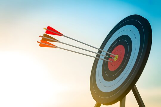 Archery target with three arrows in a gradient sky background