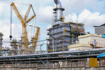 Fototapeta premium Refinery Infrastructure Featuring IoT Sensors for Methane Leak Detection and Monitoring. Sustainable Transition: Traditional Oil Refinery Integrating New Carbon Capture Unit. Wastewater Treatment.