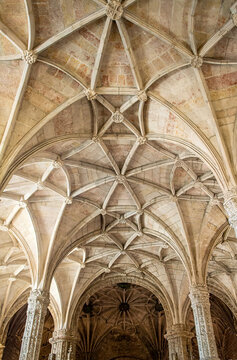 Portugal, Lisbon - 05 Aug 2018: Interior vaulted ceiling of Jeronimos Monastery church with ornate arches and carved columns.