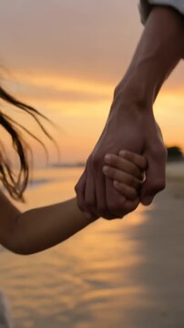 Happy little girl holding parents hands walking on the beach at sunset