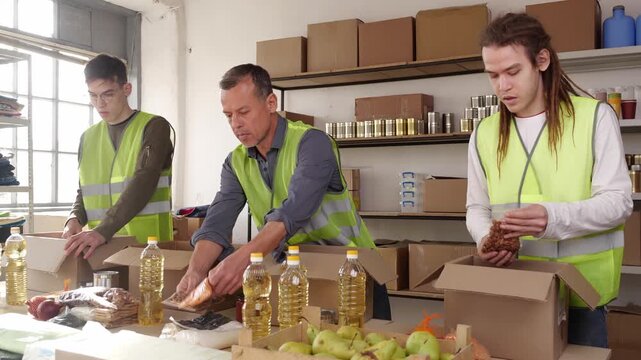 A food bank and cooperative that distributes food. Volunteers weigh food drive donations. Volunteering teams