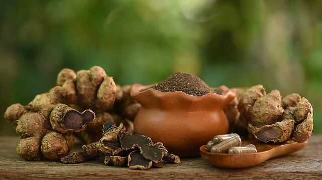 Black galingale or Kaempferia parviflora rhizomes ,dried slices, powder and capsule on natural  background.