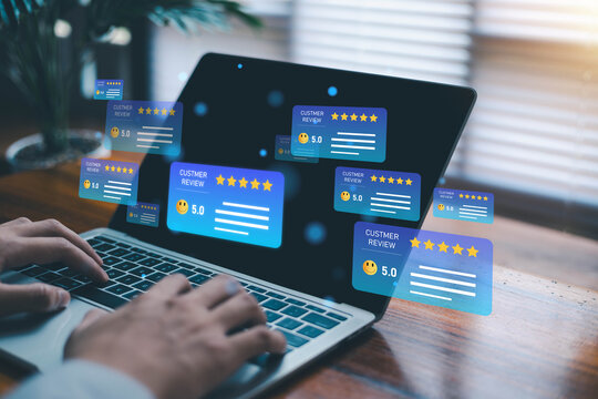 Online customer review and five star rating feedback concept with business person using laptop. Digital customer experience positive review system service quality evaluation and reputation management.