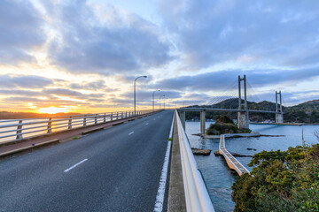 初春の呼子大橋と夕日　佐賀県唐津市　The Yobuko Bridge and sunset in early spring. Saga Pref, Karatsu City.　 © M・H