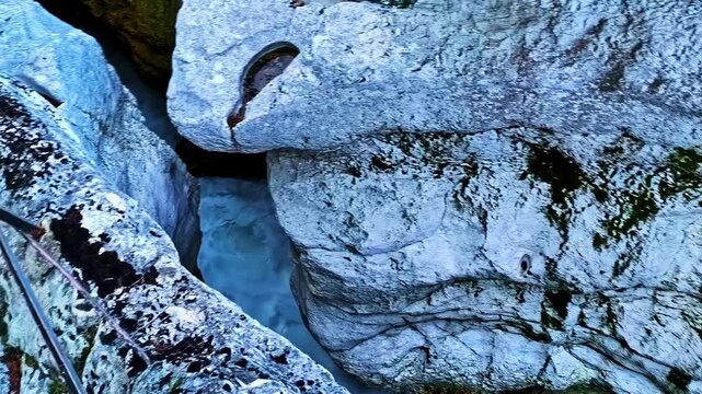 Gorges du Fier rock formation in Chavanod, France with water flow, Geological formation of a narrow gorge, showing water erosion on ancient rock surface