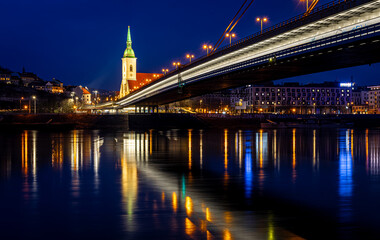 Fototapeta premium Bratislava night skyline with St Martins Cathedral bridge and reflections