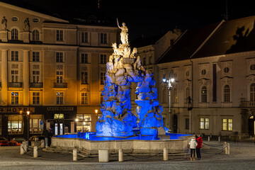 Blue lit Baroque Parnas Fountain at night in Brno, Czech Republic, Zelny trh