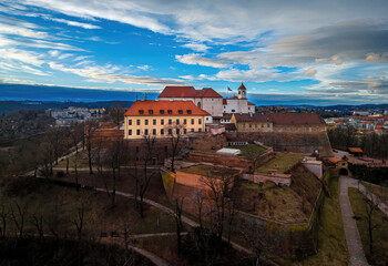 Naklejka premium Spilberk Castle and historic rooftops at sunset, Brno, Czech Republic skyline