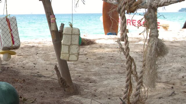 Fishing Floats and Ropes Hanging on a Tropical Beach in Phuket