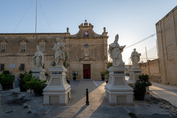 Church of St Augustine facade and statue courtyard - Rabat Ghawdex, Malta © demerzel21