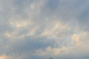 Obraz premium Tranquil Layered Cloud Formations Basked In Subtle Pastel Glow Creating Cinematic Background Atmosphere