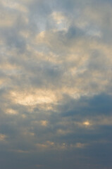Obraz premium Sunshine Amid Clouds. Radiant Sunlight Filters Through Layered Dark And Bright Clouds Atmosphere