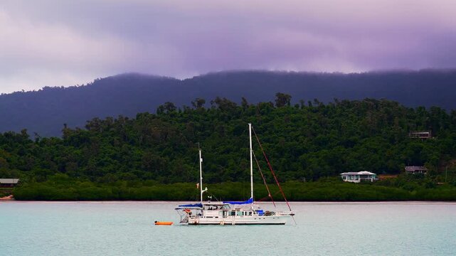 Sailboat Port of Airlie beach Coral Sea Marina boat ride cruise Great Barrier Reef Whitsunday islands Australia Queensland Hamilton Island Heart of the Reef coastline cloudy afternoon sunset pan